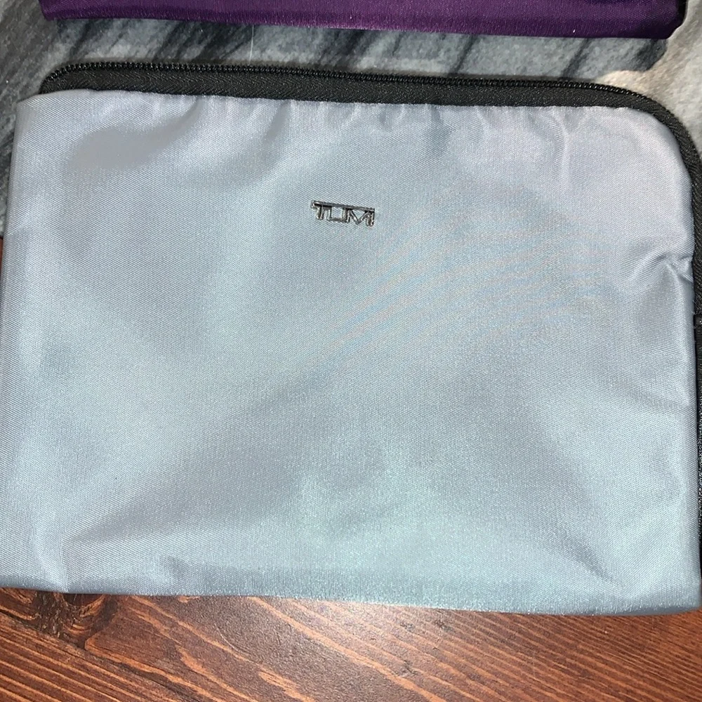 Tumi Purple and Gray Travel Pouches with Socks and sleep masks